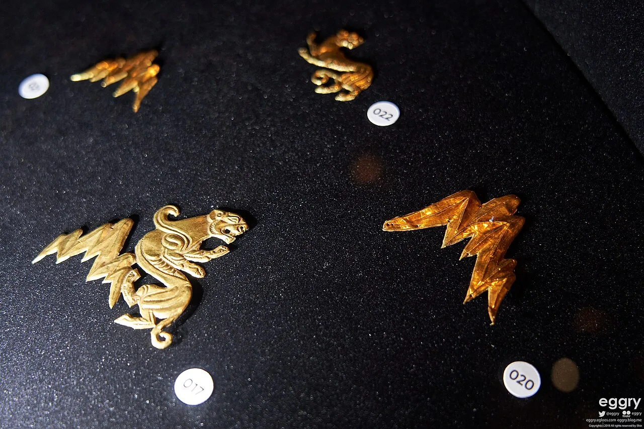 Gold ornaments and small burial objects associated with the Issyk kurgan.