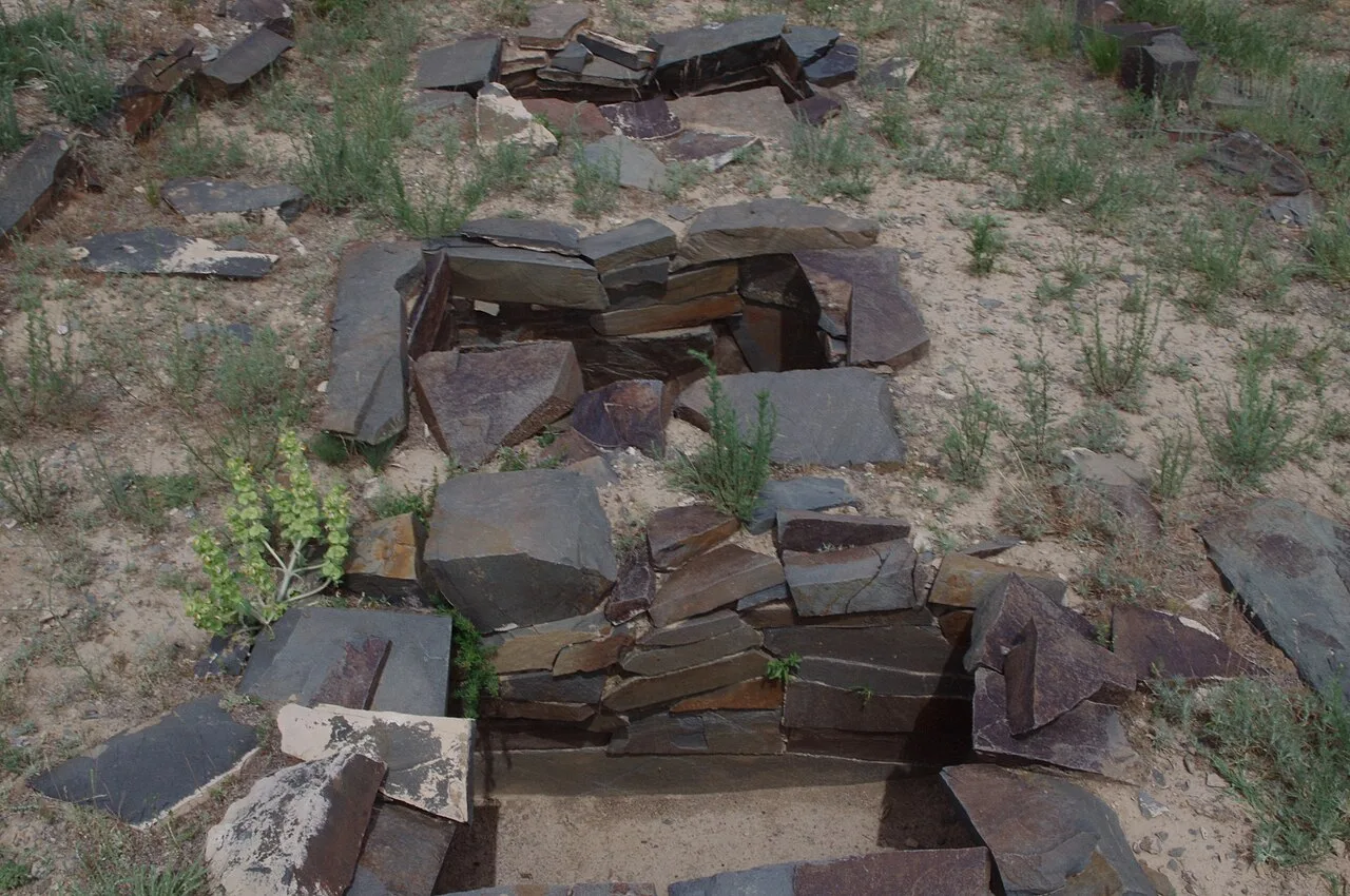 Low Bronze Age stone tombs at Tamgaly set in open steppe beyond the Karabastau turn-off.
