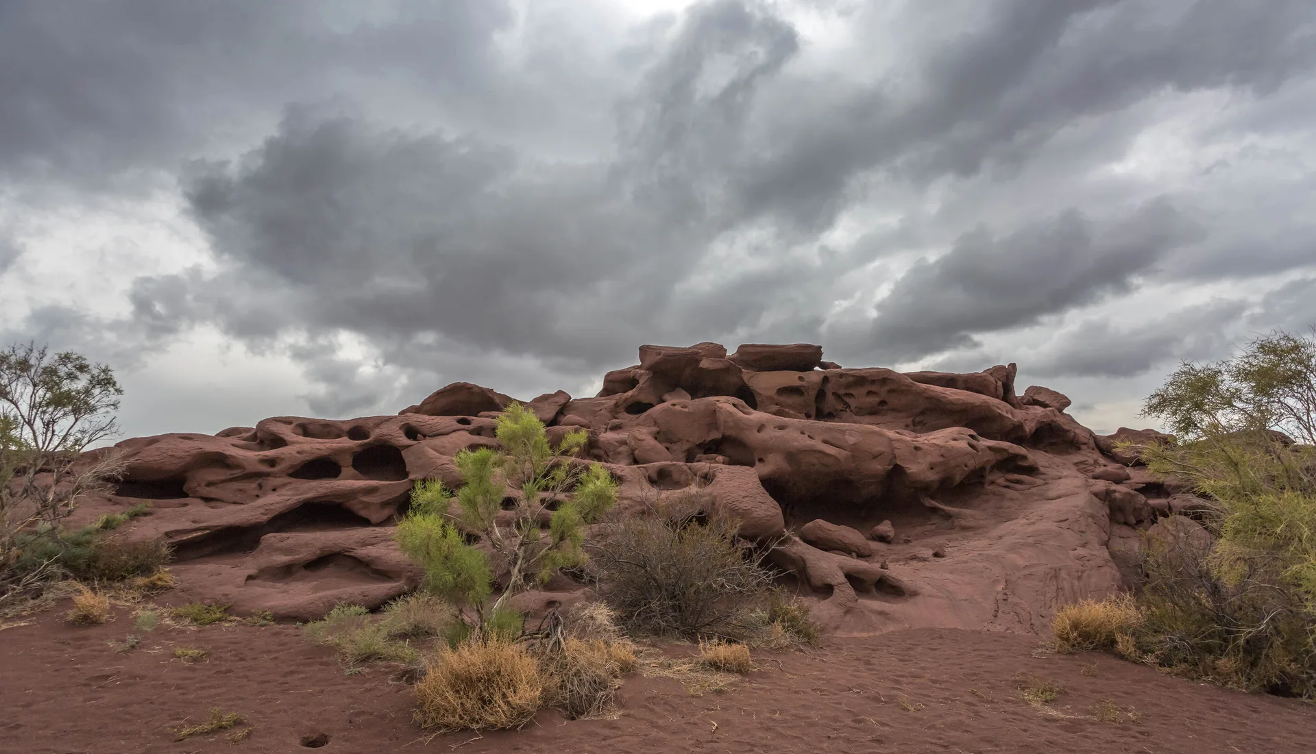 Layered volcanic hills in the Katutau Mountains, showing rough gullies and sparse steppe vegetation.