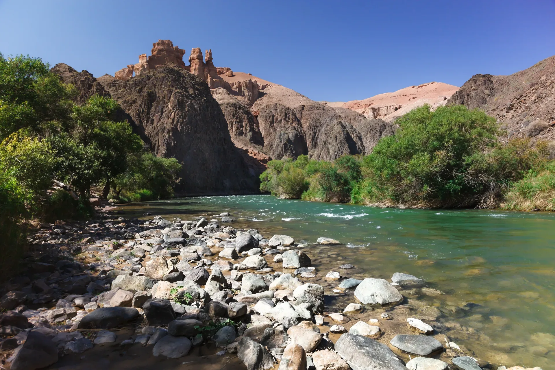 Charyn River corridor near the bridge used before the gravel track turns toward Uzunbulak.