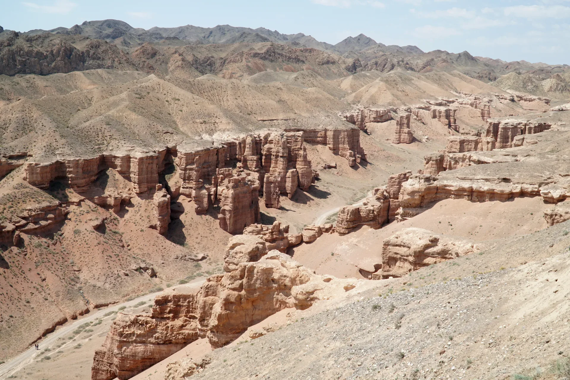 Red Valley of Castles formations on the approach before the route continues to Moon Canyon.