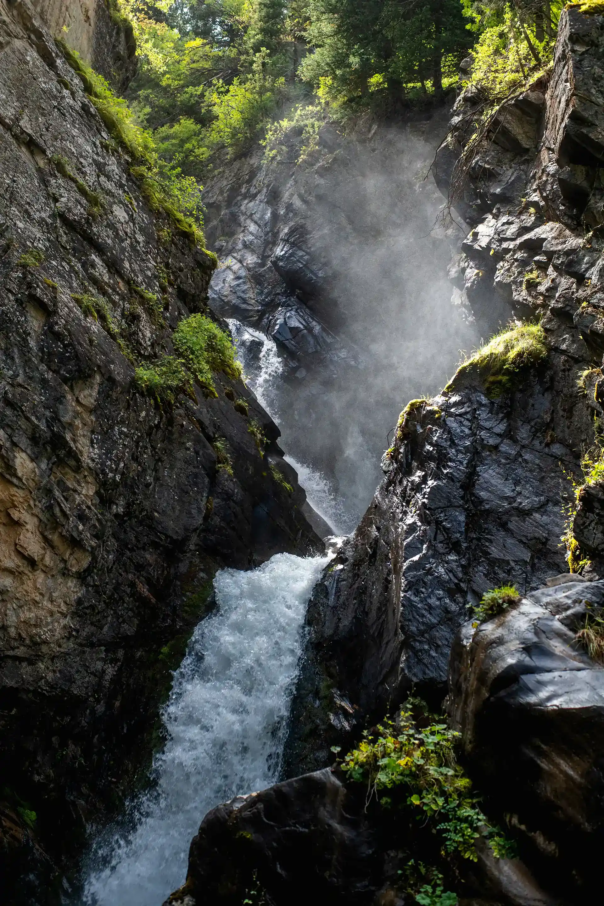 Kairak Waterfall rushing through a narrow moss-lined gorge above the Turgen valley trail system.