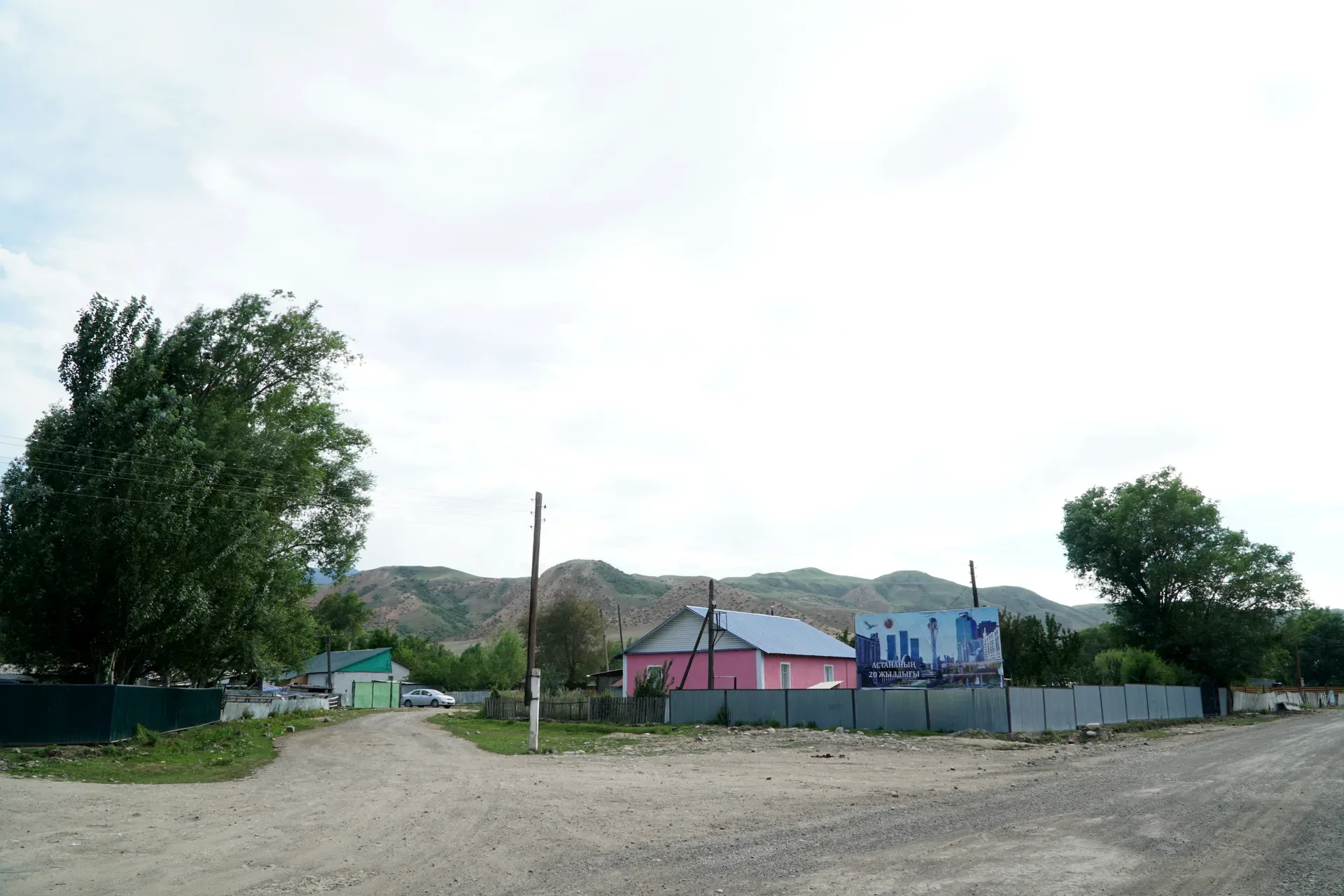 Mountain landscape near Saty with open slopes, rocky terrain, and Kungey Alatau ridgeline views.
