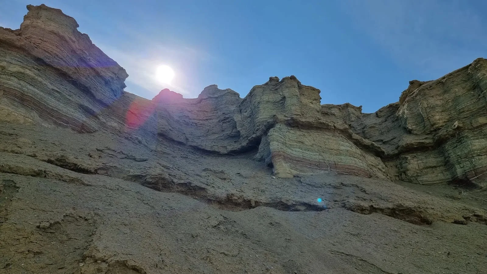 Context near Singing Dune: Late afternoon light across pale Aktau chalk ridges and desert scrub.