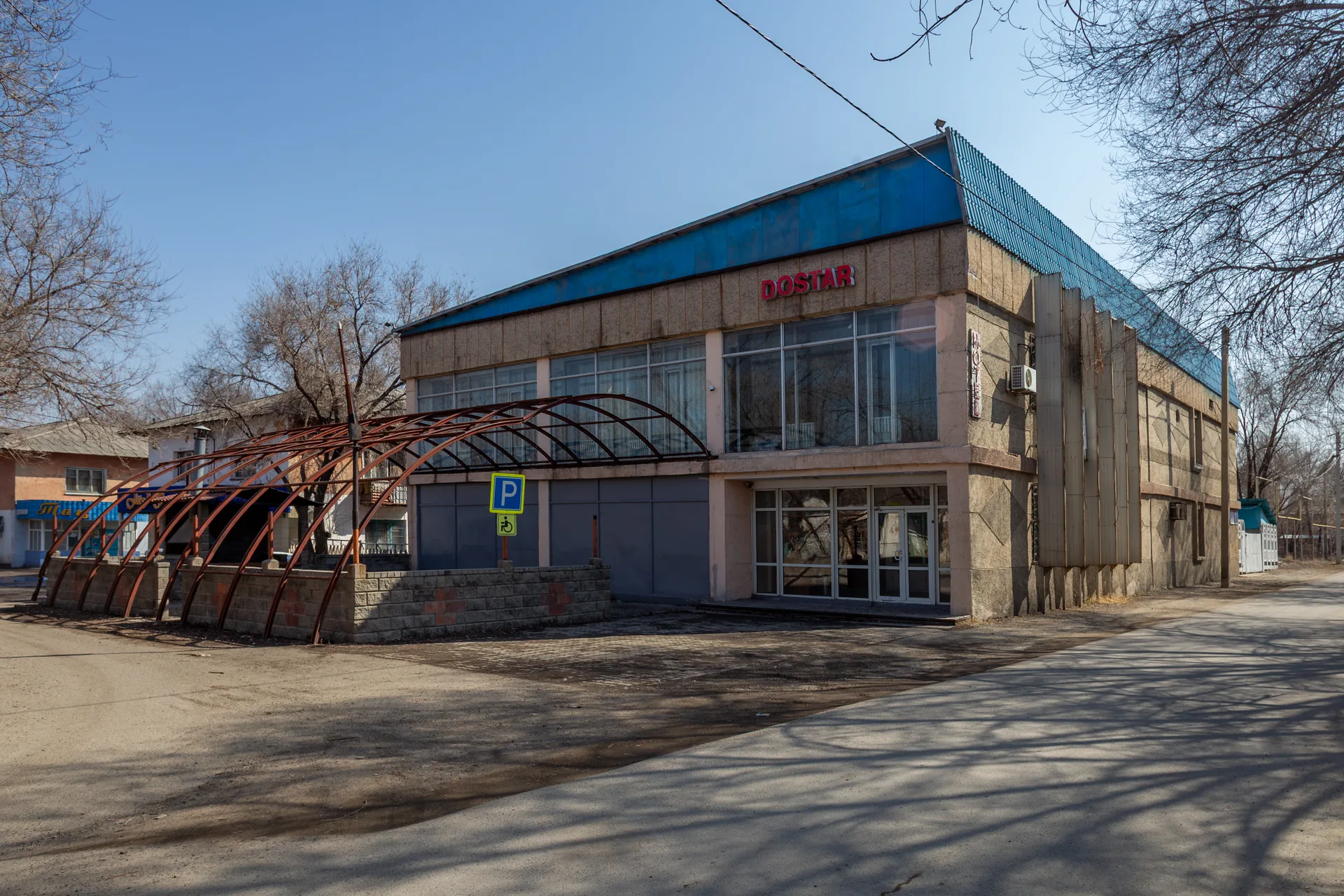 Small service building in the Karatal area, representing roadside stops beyond Taldykorgan.