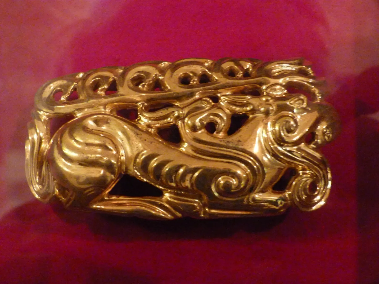 Context near Talkhiz Medieval Mounds: Gold flying-elk plaque from the Issyk burial mound used as wider regional archaeological context.