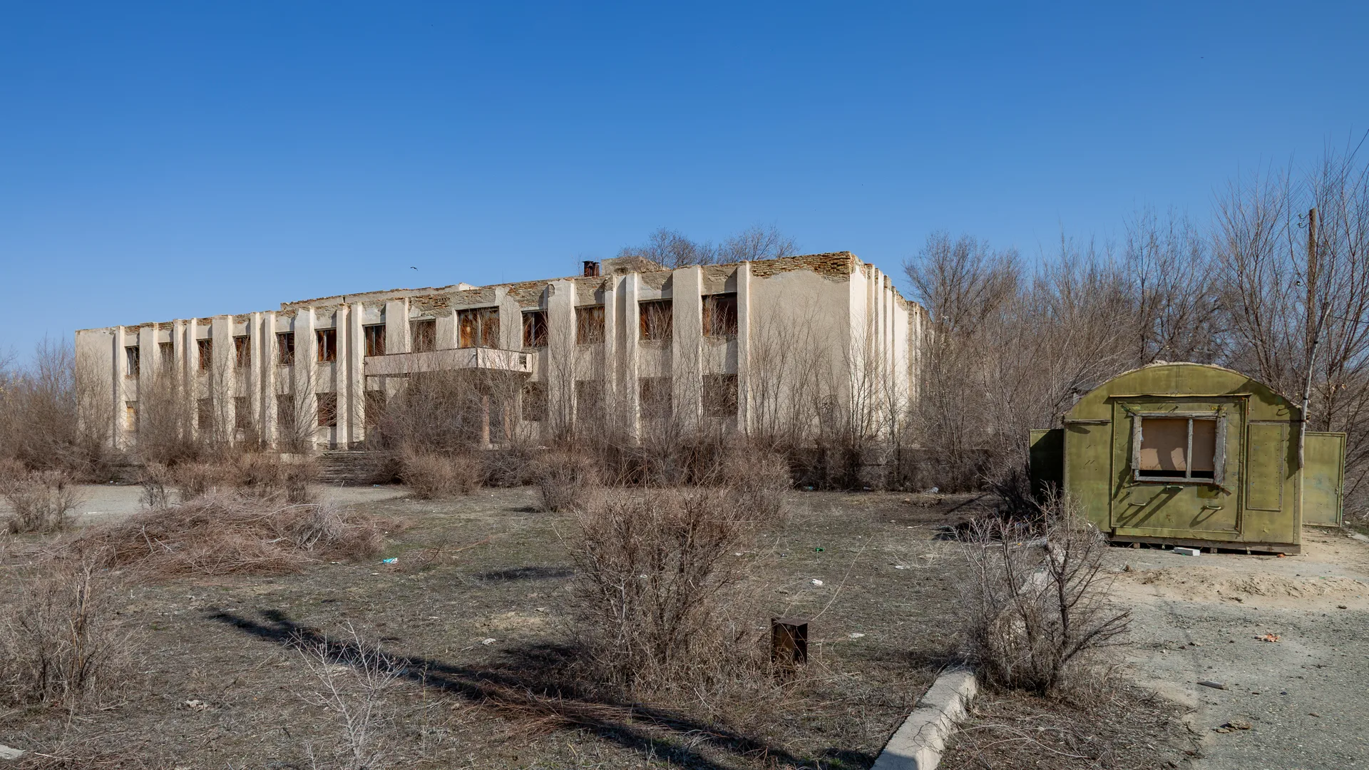 Bastobe cultural house in the Ushtobe district, set back from a broad village street.
