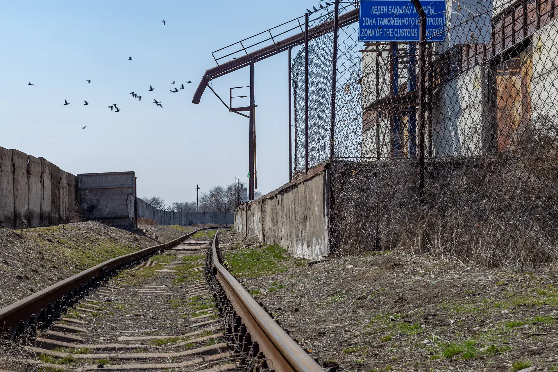 Rail spur and factory buildings at the Ushtobe yurt-building plant on the eastern approach.