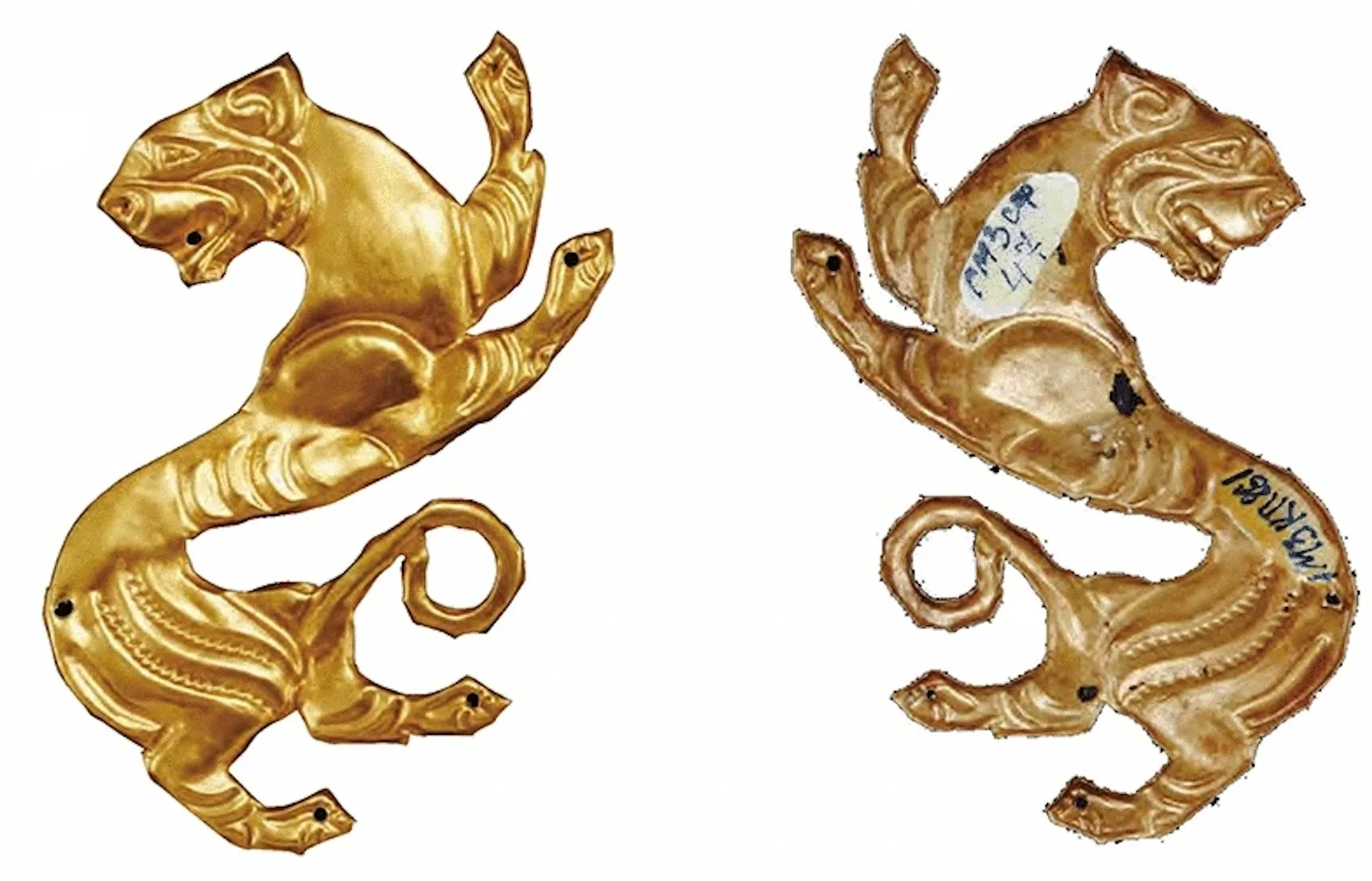 Gold plaques in tiger form from the Issyk Kurgan, Kazakhstan, showing intricate Saka-period goldwork with curled animal bodies in the Scythian animal style